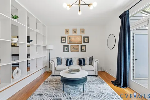 a view of living room with furniture and lamp