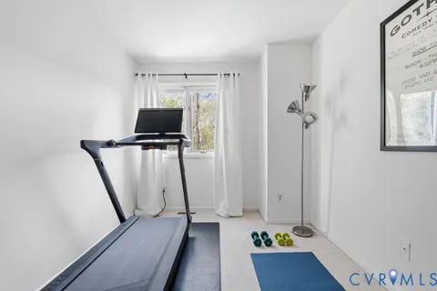 a view of a patio with table and chairs and potted plants