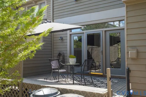 a view of backyard of house with seating space