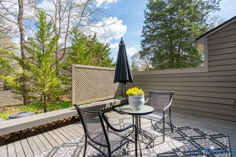 a view of house with backyard space and patio