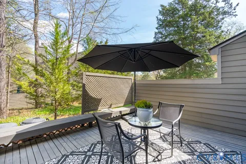 an aerial view of a houses with a lake view