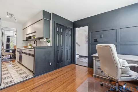 a kitchen with stainless steel appliances granite countertop a stove and cabinets