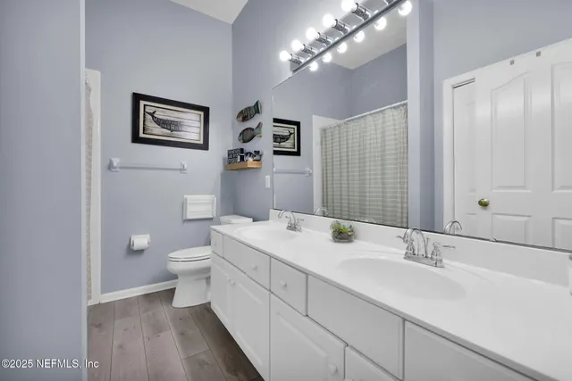 a kitchen with a refrigerator and a stove