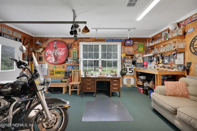 a car parked in front of a house with a yard