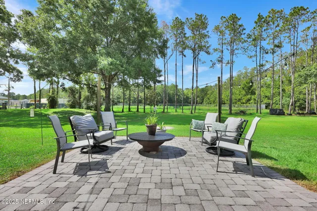 a view of a house with a door and a yard