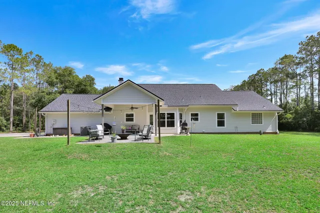 a view of a house with a big yard