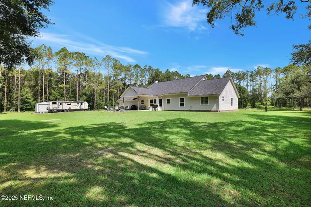 a view of lake with green space