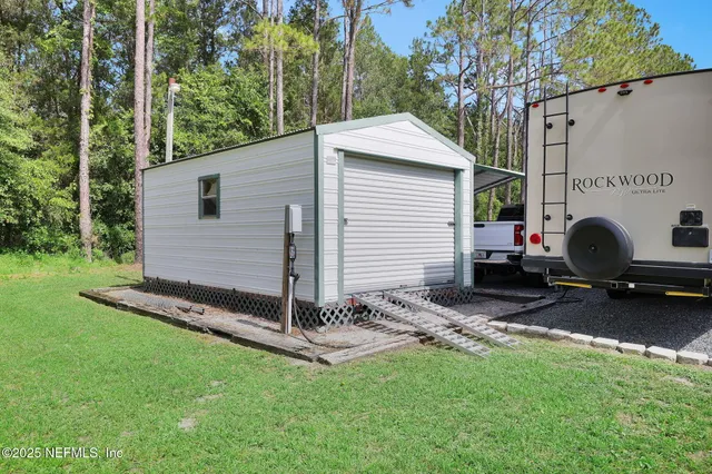 a view of a lake with a yard