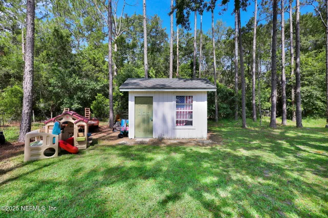 swimming pool view with a garden