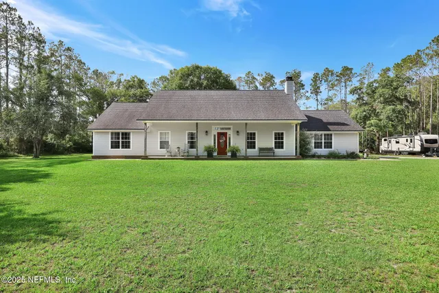 a view of a potted plants next to a yard