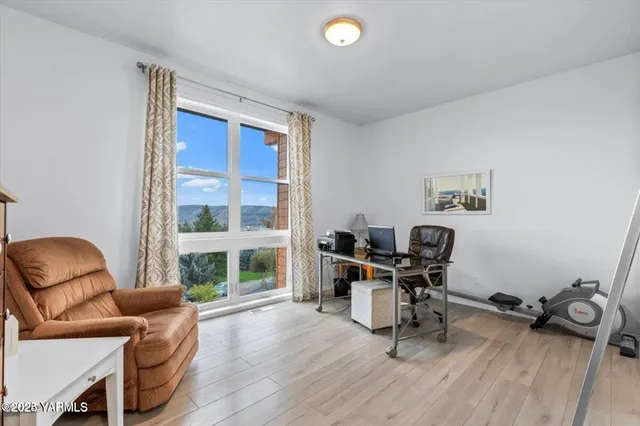 a work room with furniture and a window