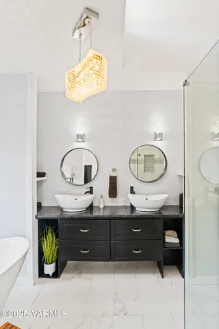 a bathroom with a double vanity sink and a mirror