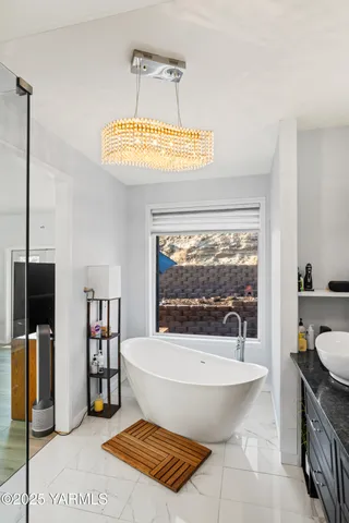 a bathroom with a bathtub and a sink
