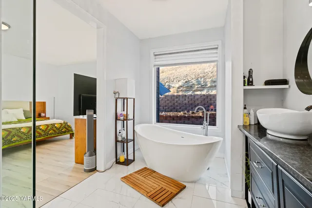a bathroom with a bathtub sink and toilet