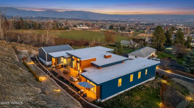 an aerial view of a house with a ocean view