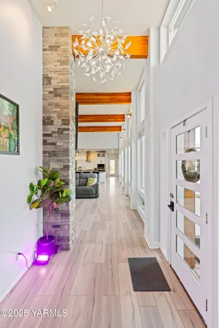 a hallway with a potted plant in front of it
