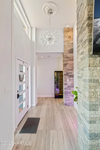 a view of an entryway with wooden floor