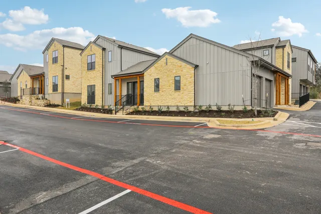 a view of a house with a street