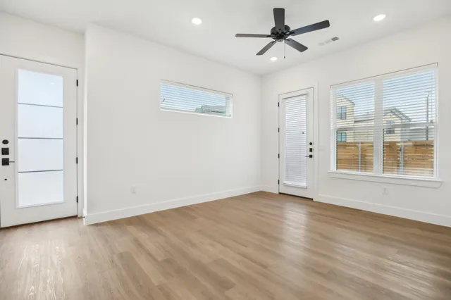 wooden floor in an empty room with a window