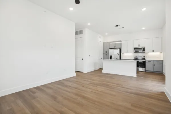 a view of a kitchen with wooden floor
