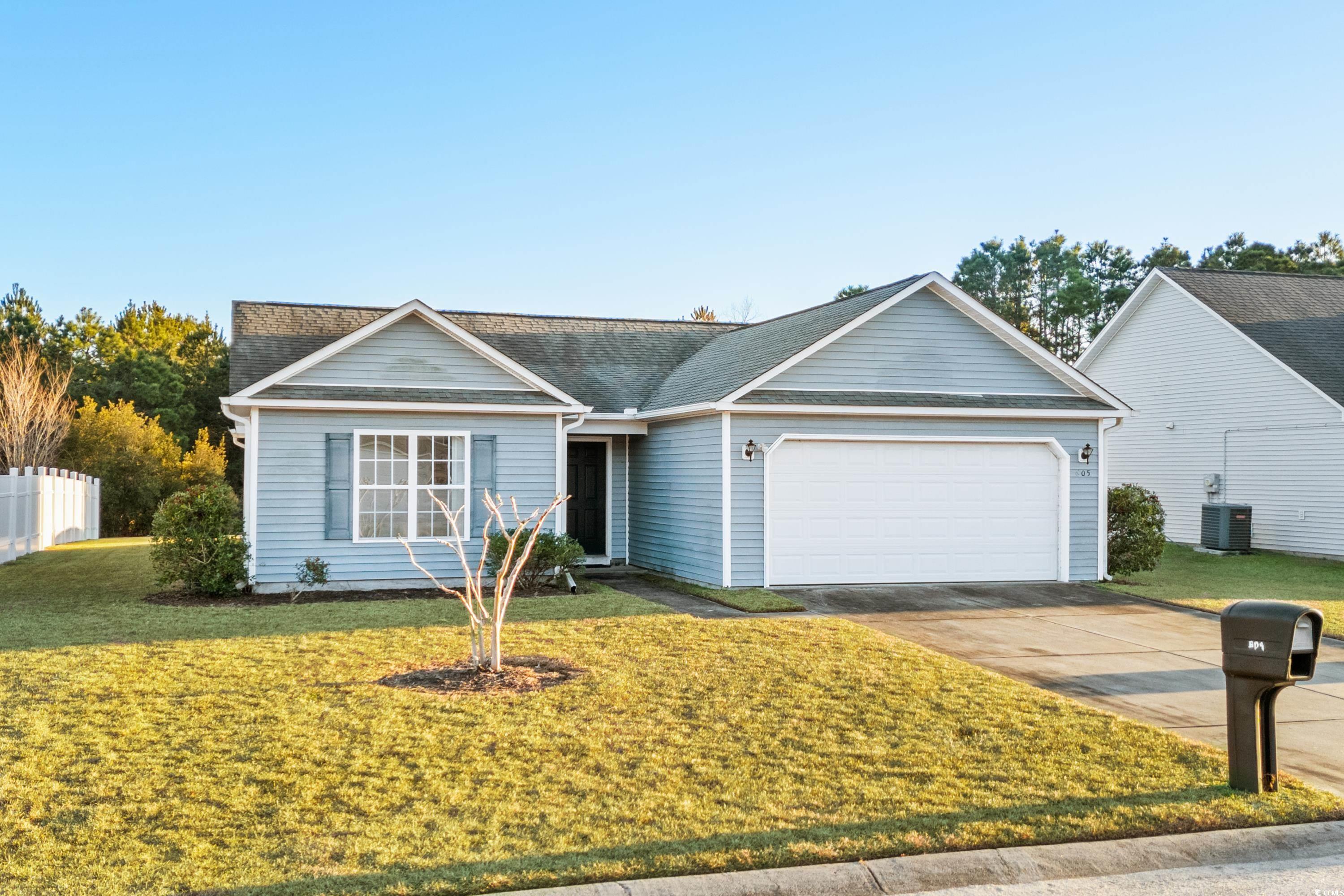 605 West Perry Road Myrtle Beach, SC 29579 - Photo 1 of 36 Ranch-style home with a front yard, a garage, and