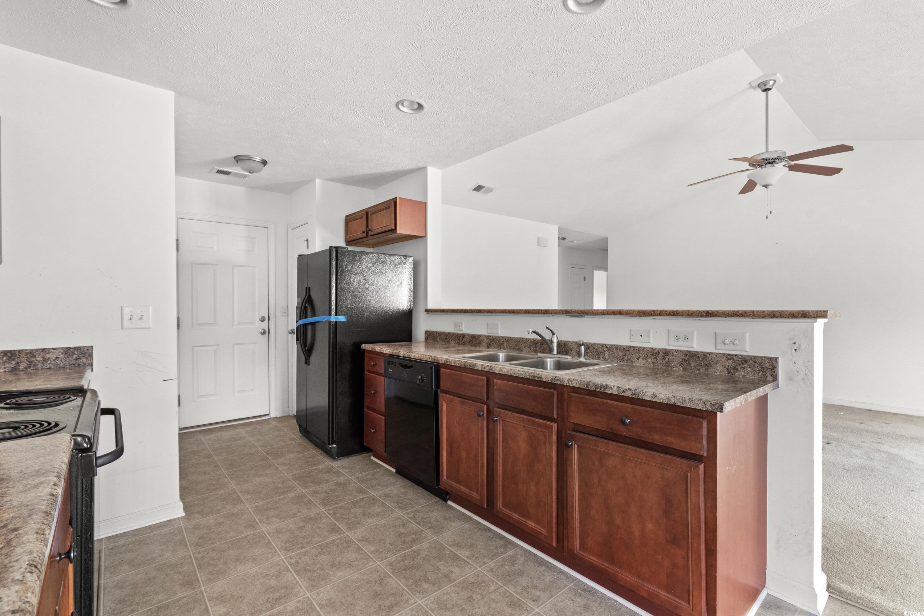 605 West Perry Road Myrtle Beach, SC 29579 - Photo 11 of 36 Kitchen with a textured ceiling, black appliances,