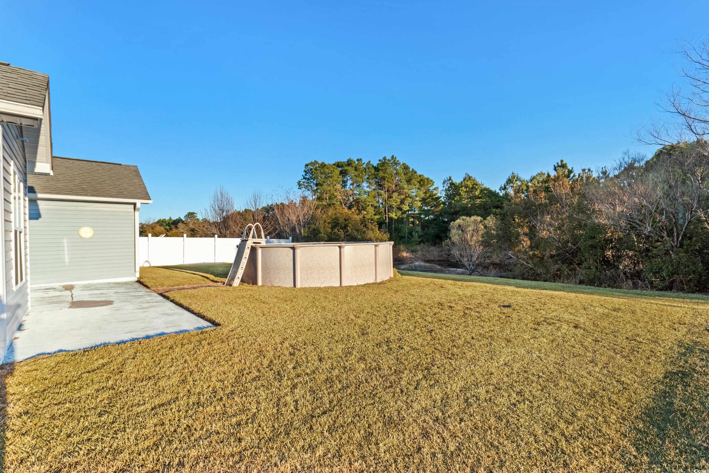 605 West Perry Road Myrtle Beach, SC 29579 - Photo 18 of 36 View of yard with a patio area