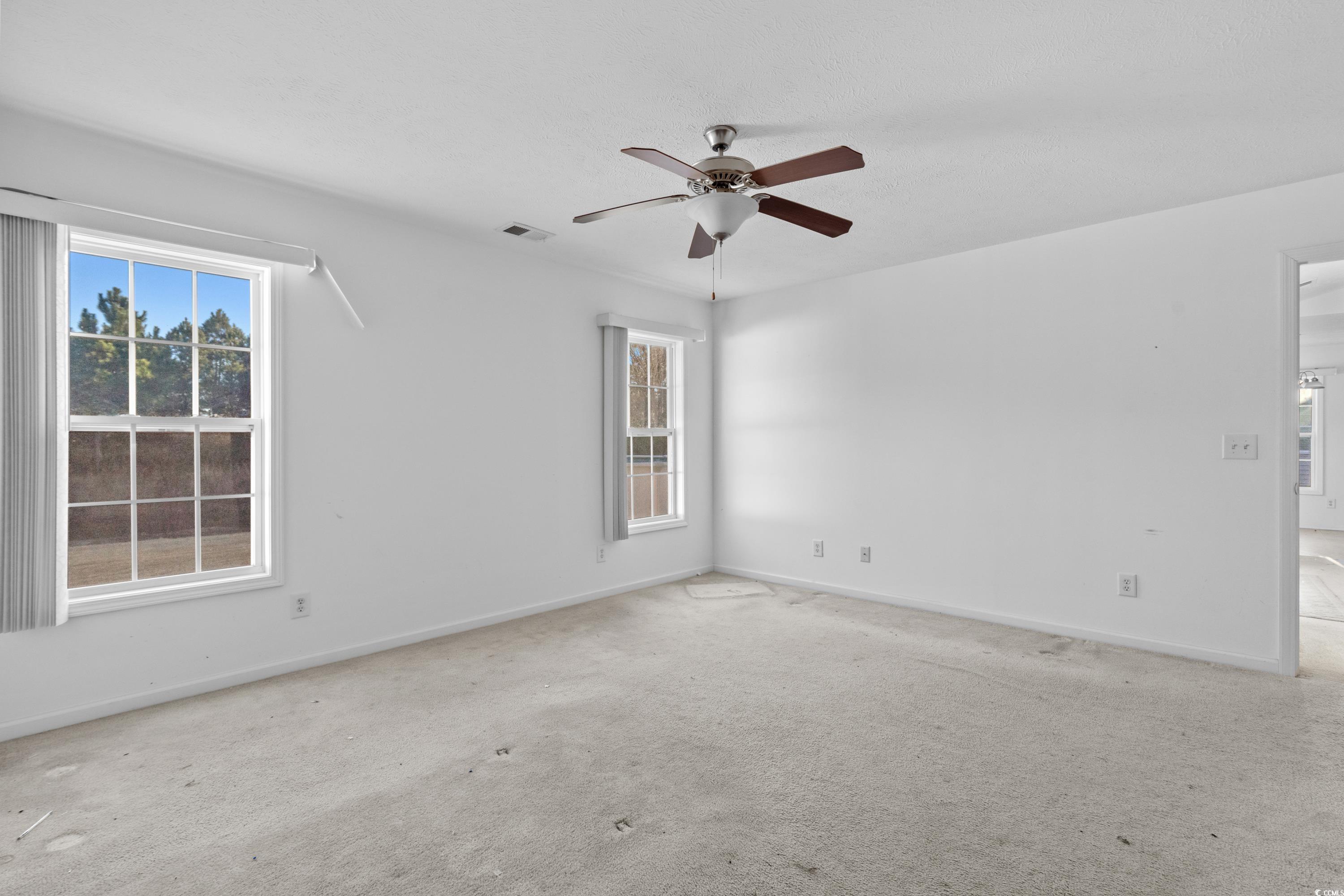 605 West Perry Road Myrtle Beach, SC 29579 - Photo 23 of 36 Unfurnished room featuring ceiling fan and light c
