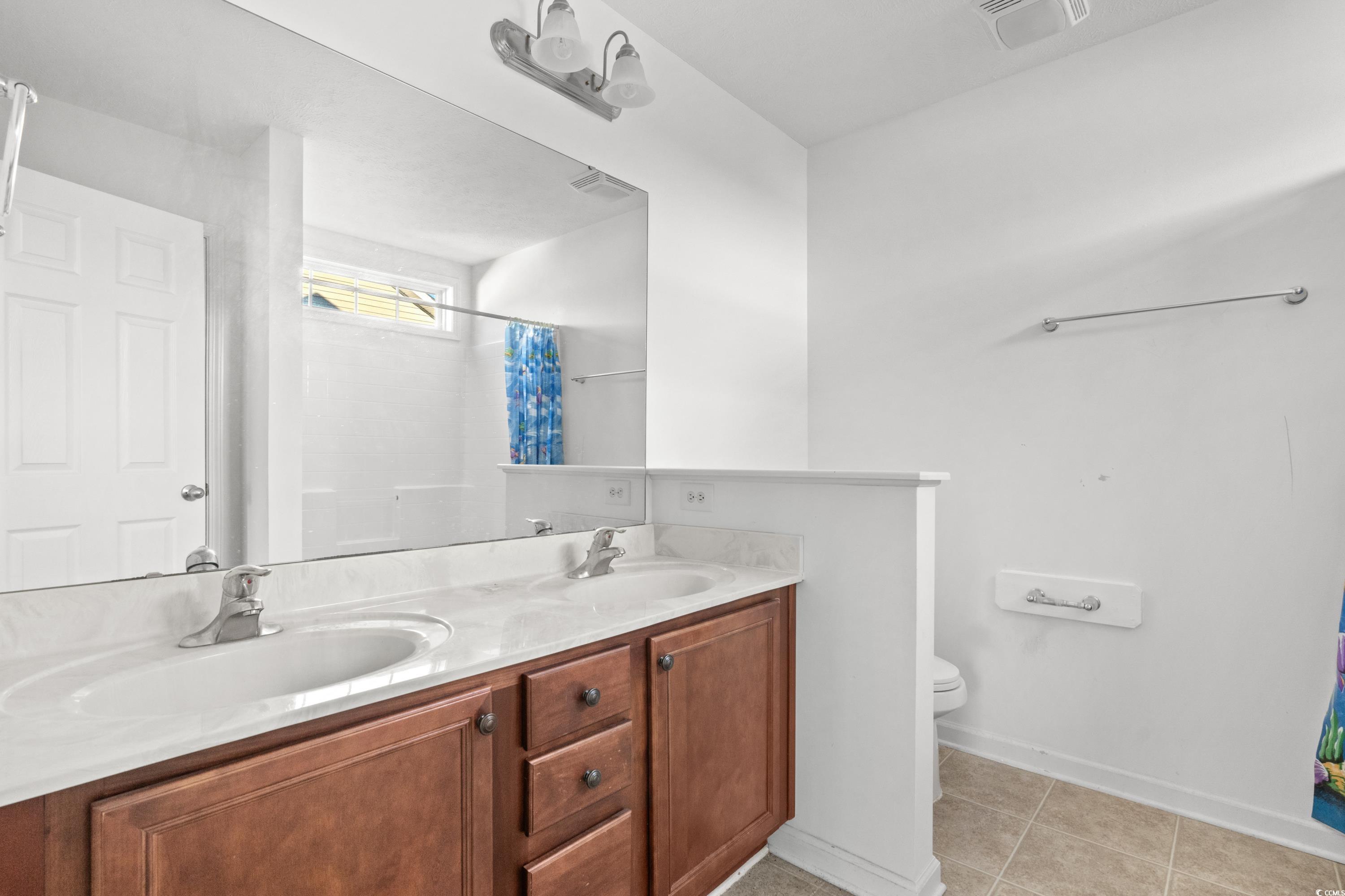 605 West Perry Road Myrtle Beach, SC 29579 - Photo 25 of 36 Bathroom with toilet, tile patterned floors, walk