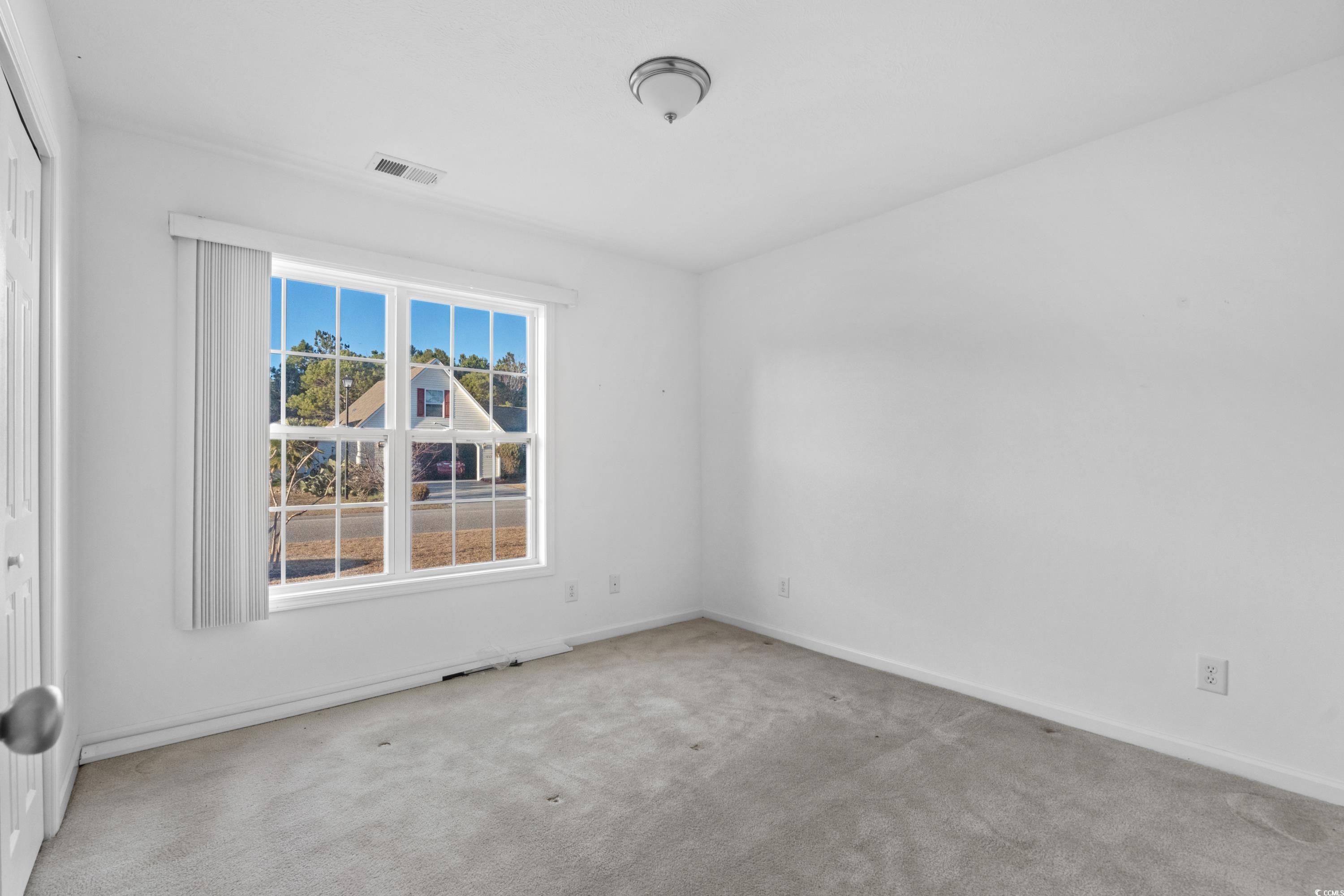 605 West Perry Road Myrtle Beach, SC 29579 - Photo 27 of 36 Unfurnished room featuring light colored carpet