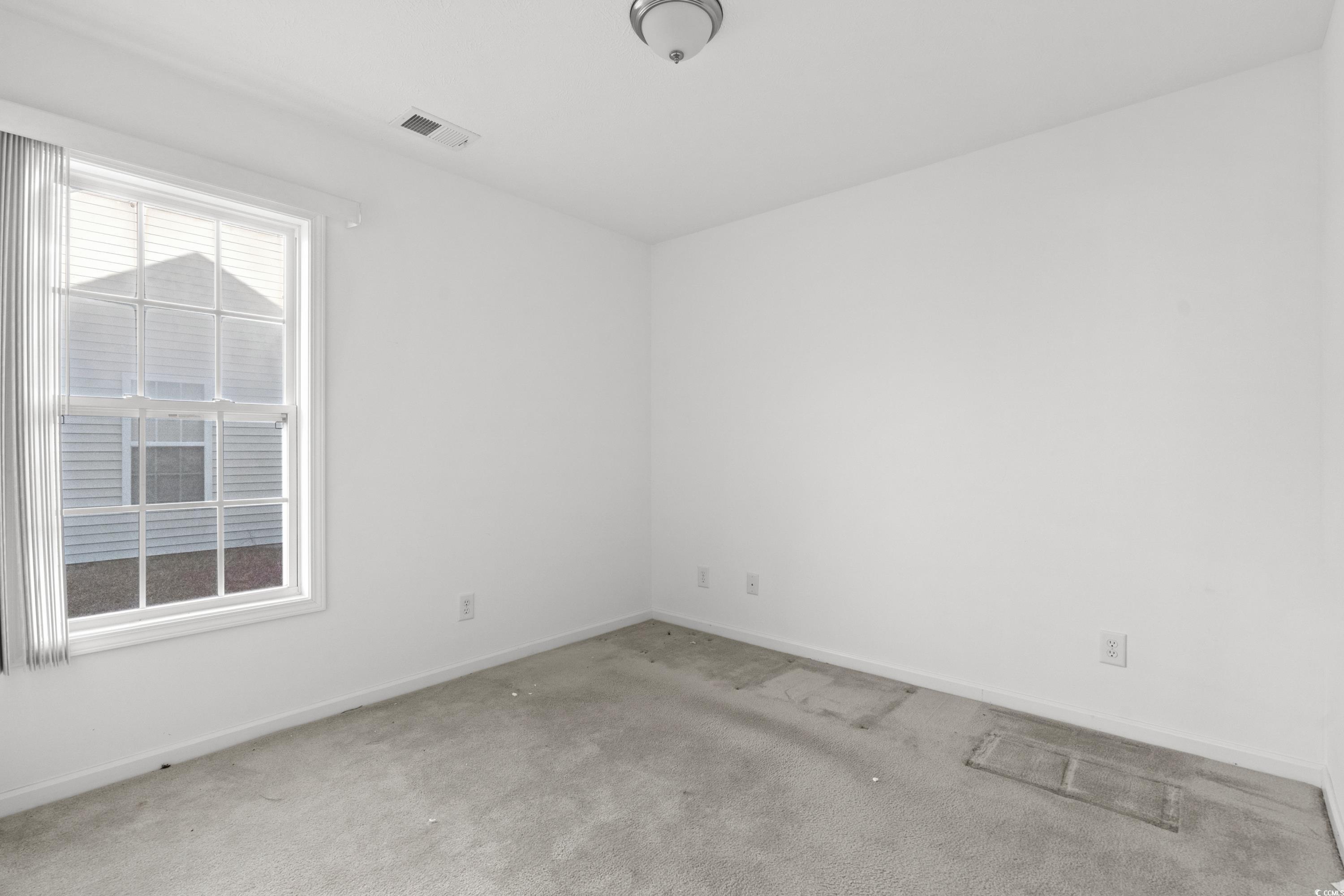 605 West Perry Road Myrtle Beach, SC 29579 - Photo 28 of 36 Empty room featuring light colored carpet