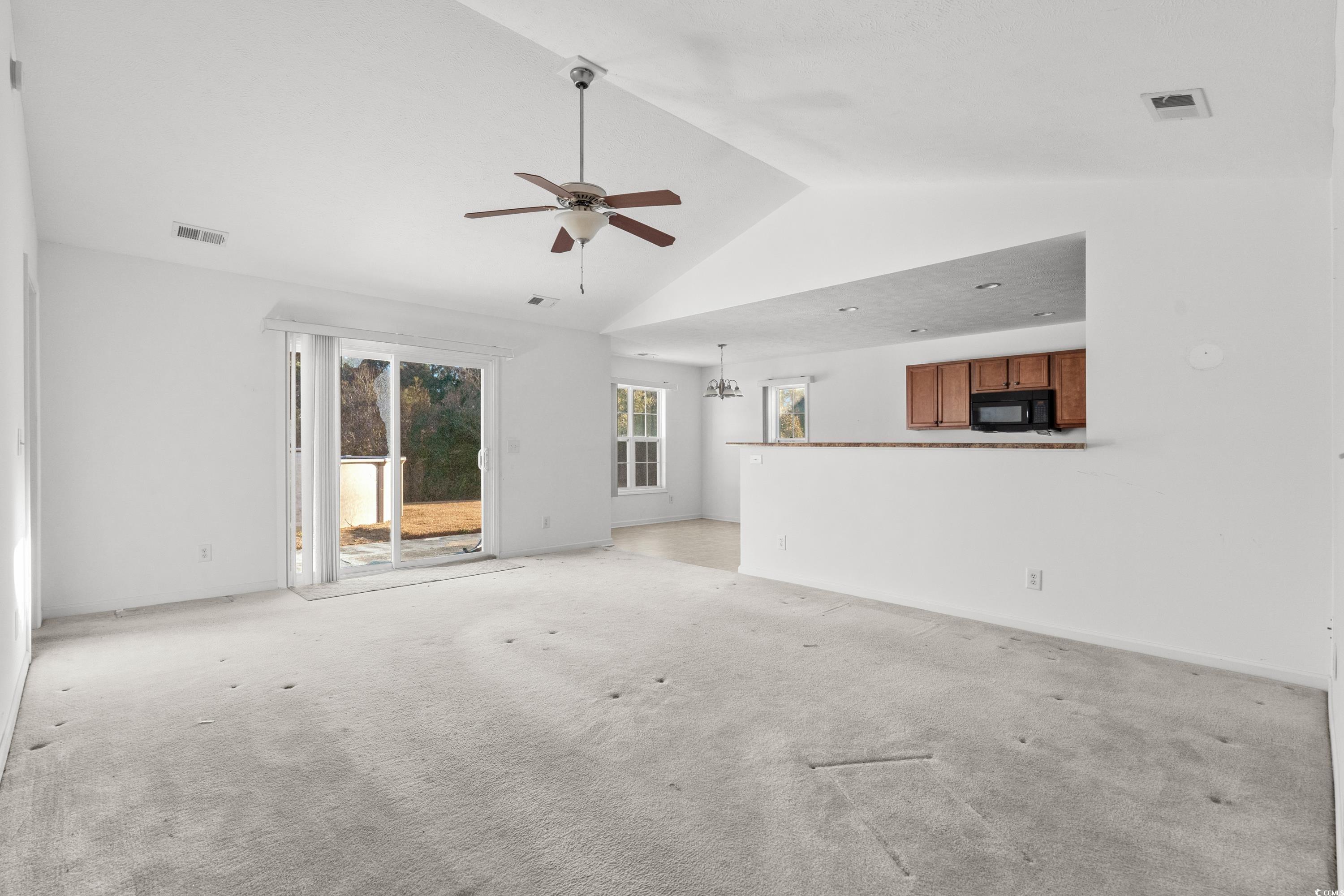 605 West Perry Road Myrtle Beach, SC 29579 - Photo 4 of 36 Unfurnished living room featuring ceiling fan with