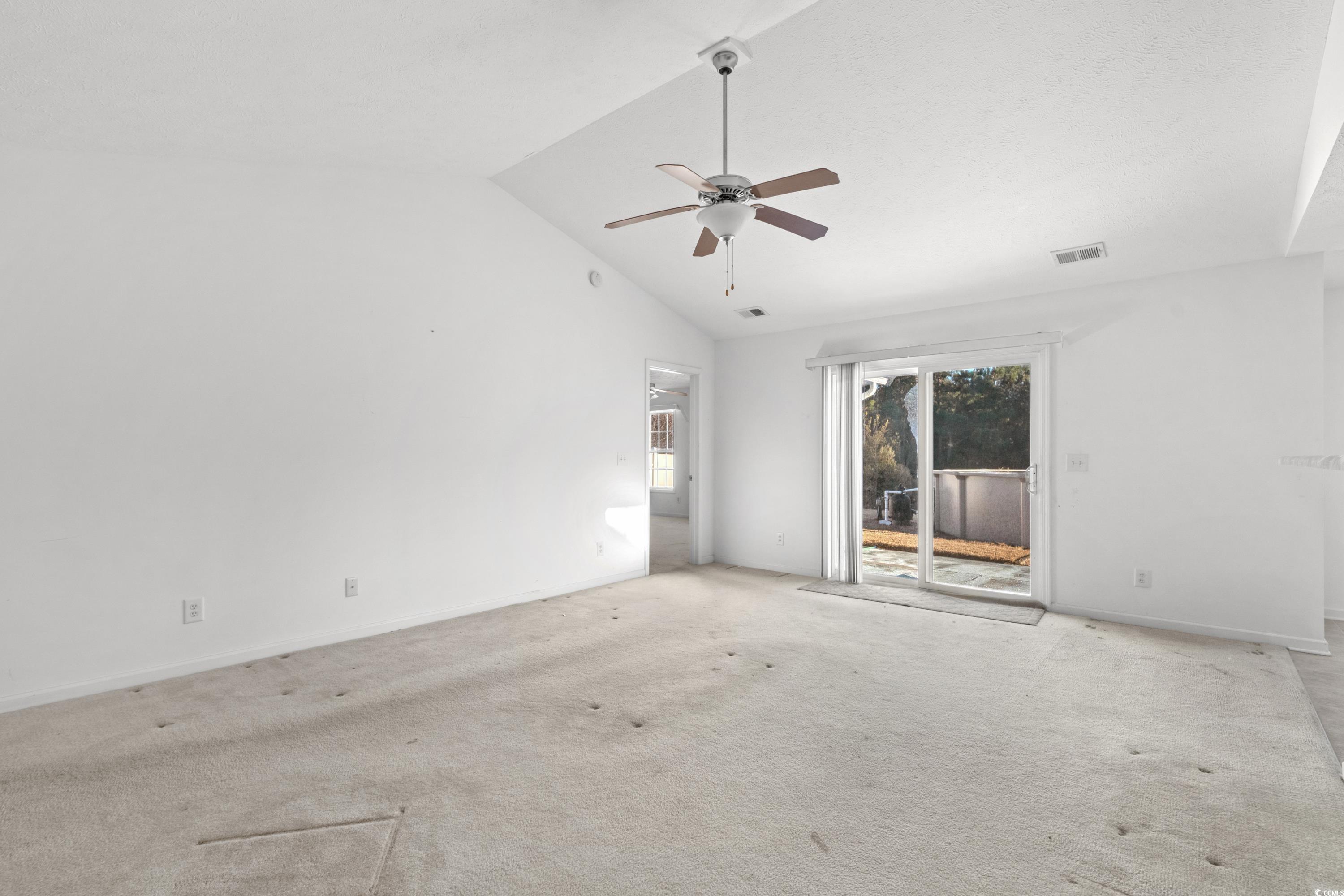 605 West Perry Road Myrtle Beach, SC 29579 - Photo 5 of 36 Unfurnished room with high vaulted ceiling, light