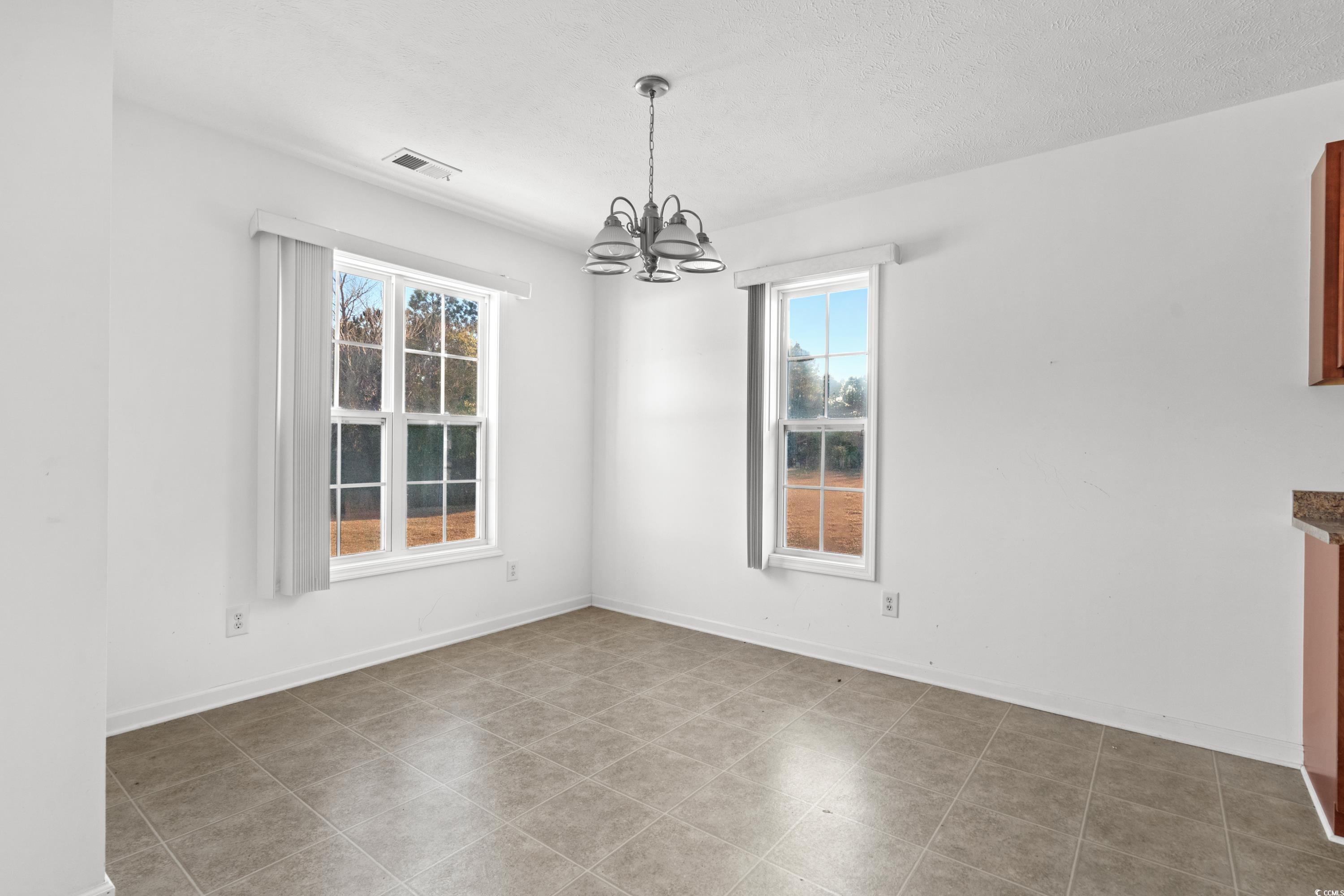 605 West Perry Road Myrtle Beach, SC 29579 - Photo 8 of 36 Unfurnished dining area with a healthy amount of s