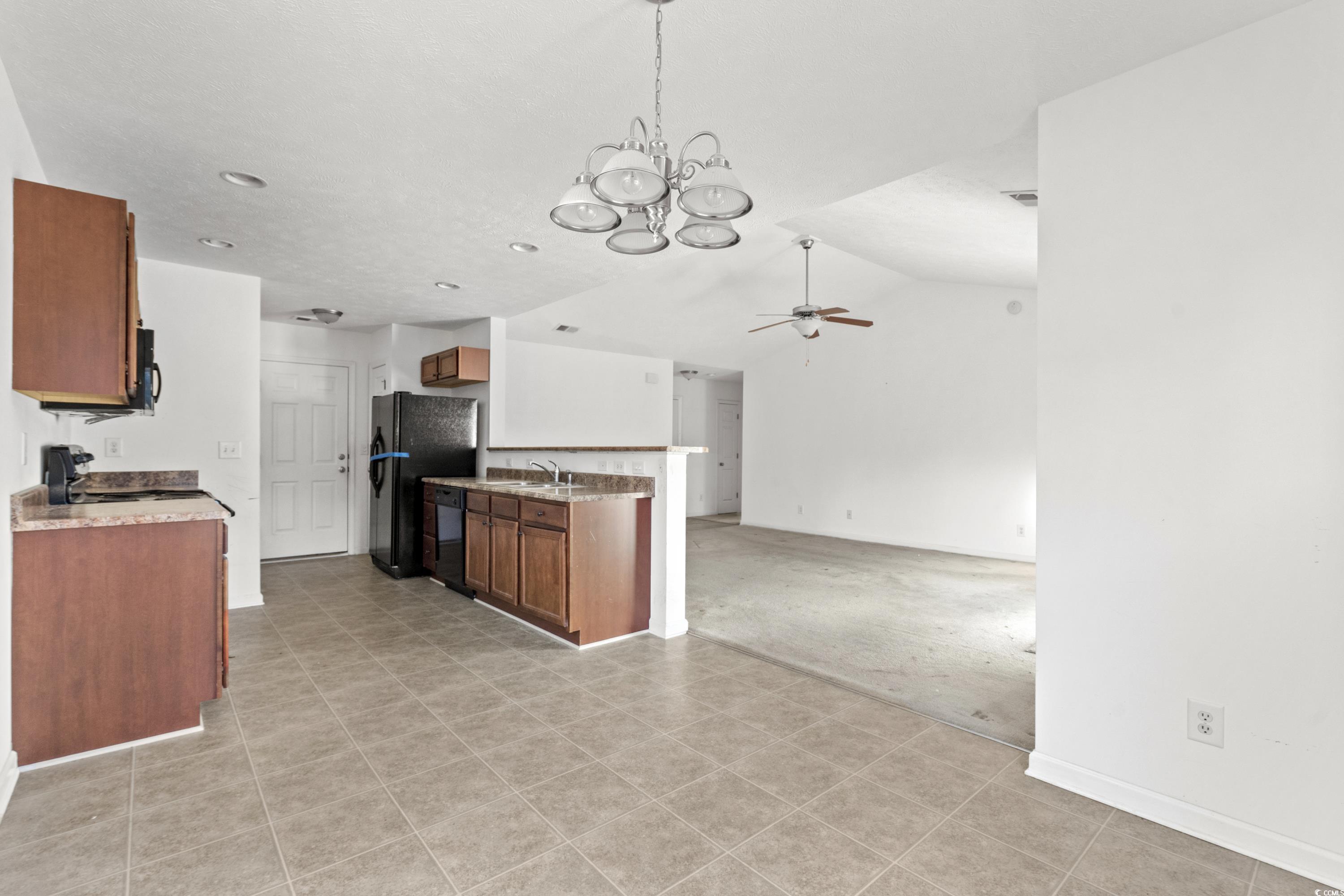 605 West Perry Road Myrtle Beach, SC 29579 - Photo 9 of 36 Kitchen with lofted ceiling, ceiling fan, black ap