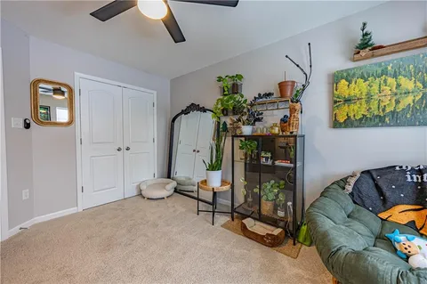 a living room with furniture a air conditioner vent and a window