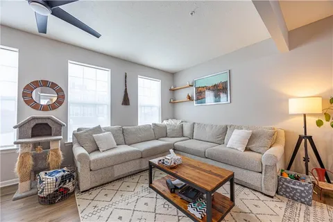 a living room with furniture and a window