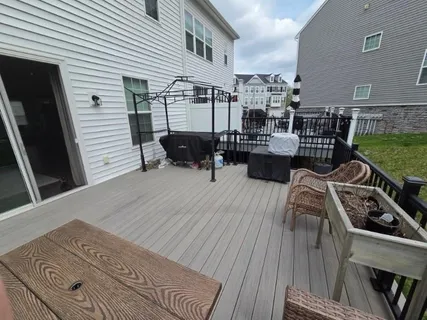a view of a terrace with wooden floor and outdoor seating