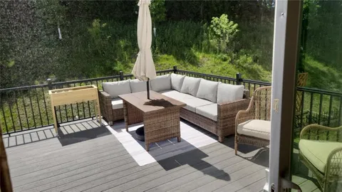 a view of a deck with furniture