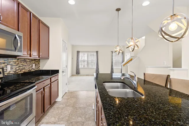 a kitchen with sink cabinets and window