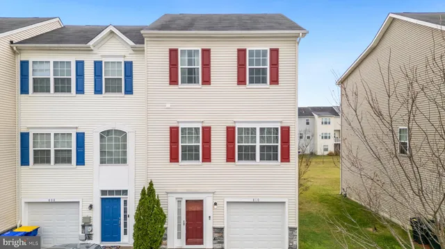 a front view of a house with large windows