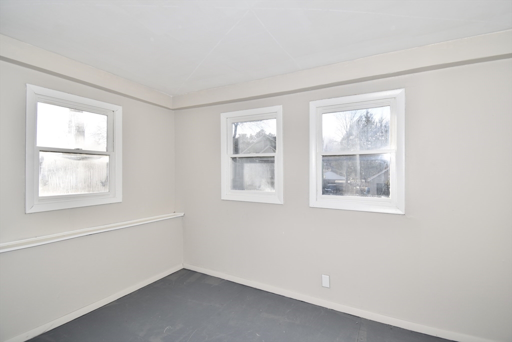 51-53 Eloise Street Springfield, MA 01118 - Photo 12 of 20 an empty room with windows