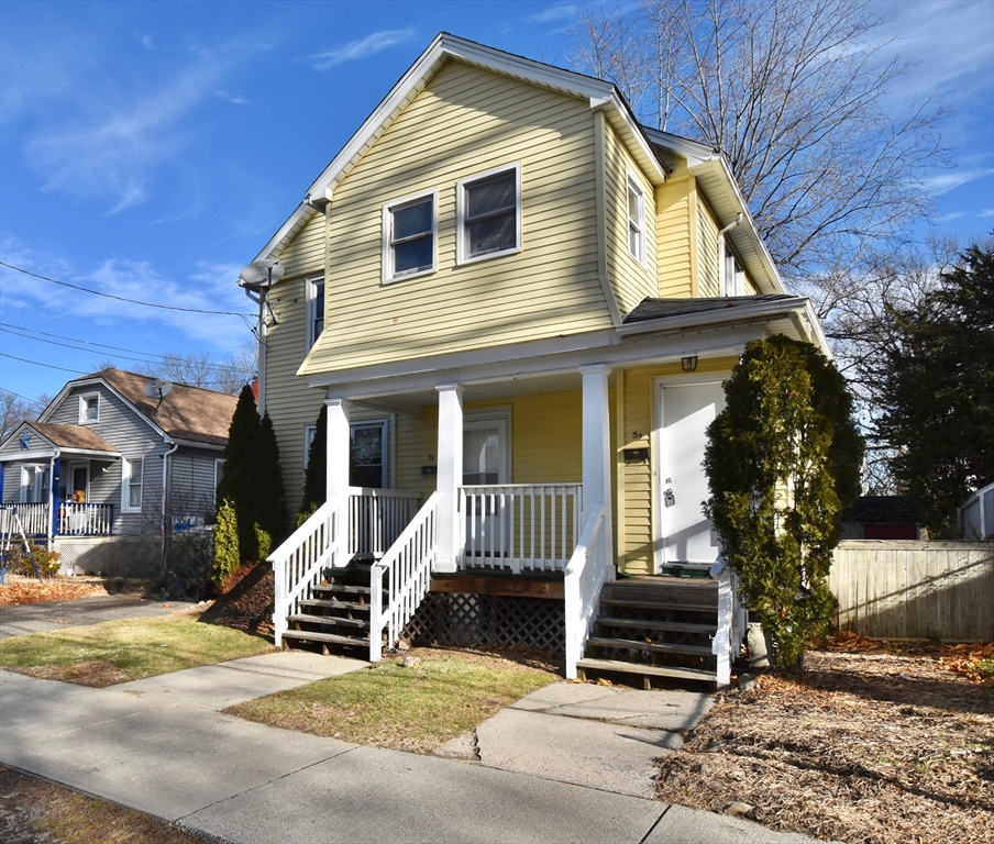 51-53 Eloise Street Springfield, MA 01118 - Photo 2 of 20 a view of a house with a patio