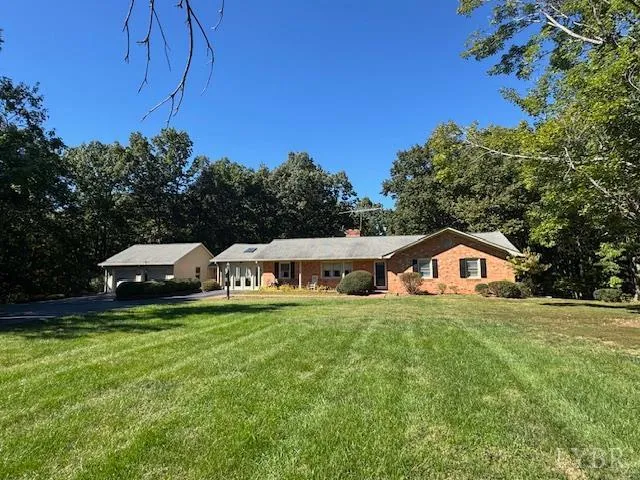 a front view of a house with a yard and porch
