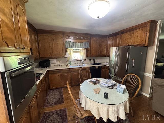 733 Morning Star Road Appomattox, VA 24522 - Photo 18 of 33 a kitchen with sink a refrigerator and chairs