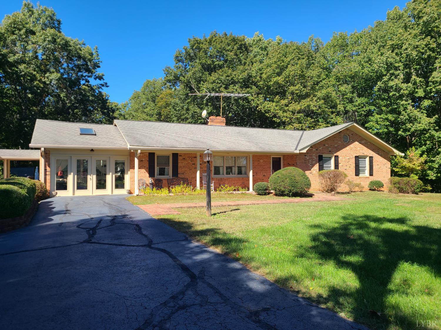 733 Morning Star Road Appomattox, VA 24522 - Photo 2 of 33 a front view of a house with a yard and porch