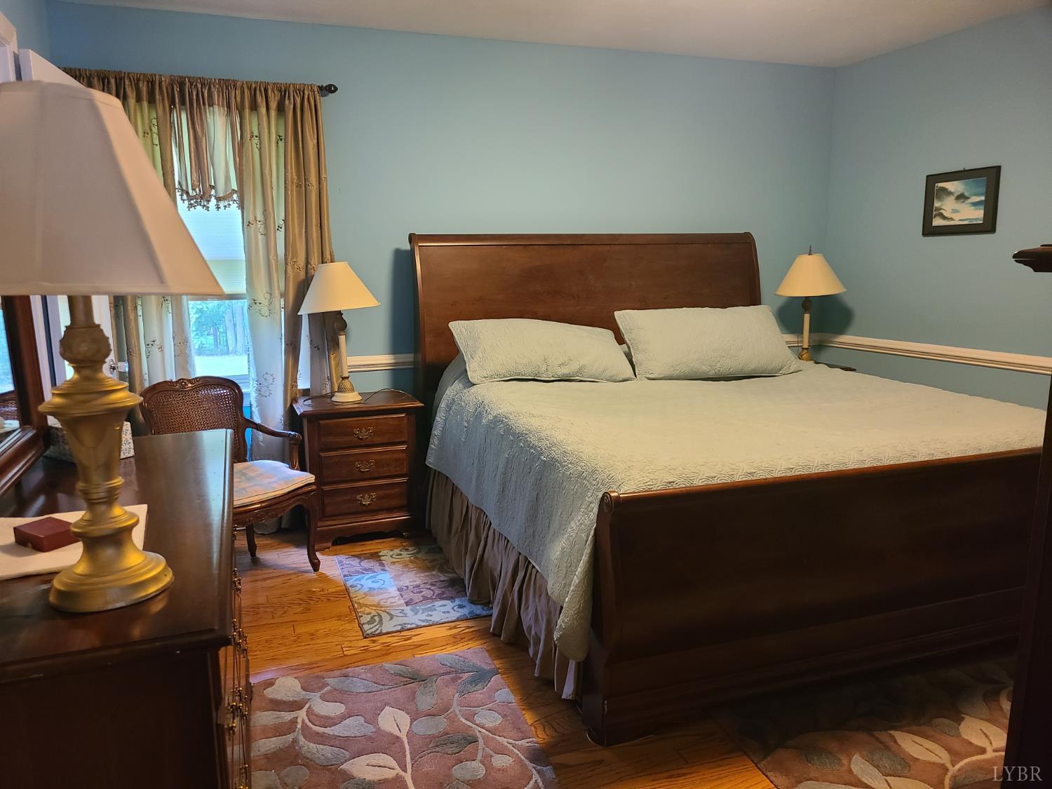 733 Morning Star Road Appomattox, VA 24522 - Photo 31 of 33 a bed sitting in a bedroom next to a window