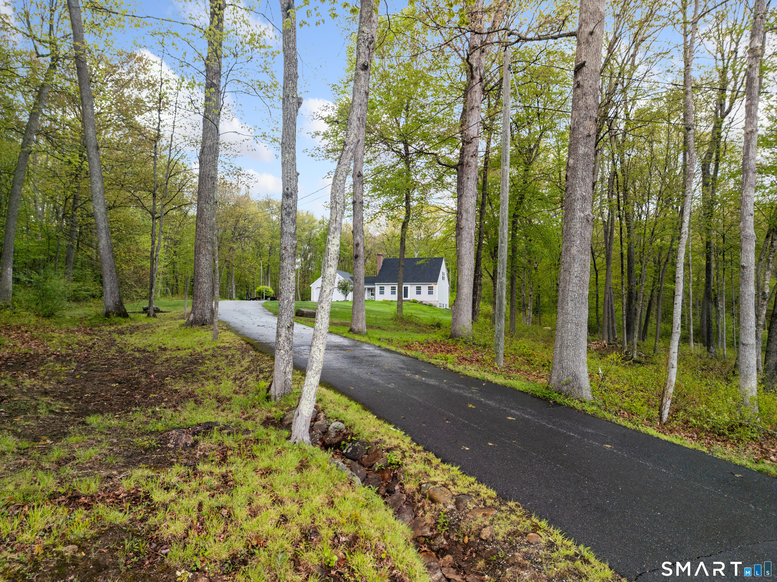 362 Turnpike Road Ashford, CT 06278 - Photo 11 of 40 a backyard of a house with table and chairs