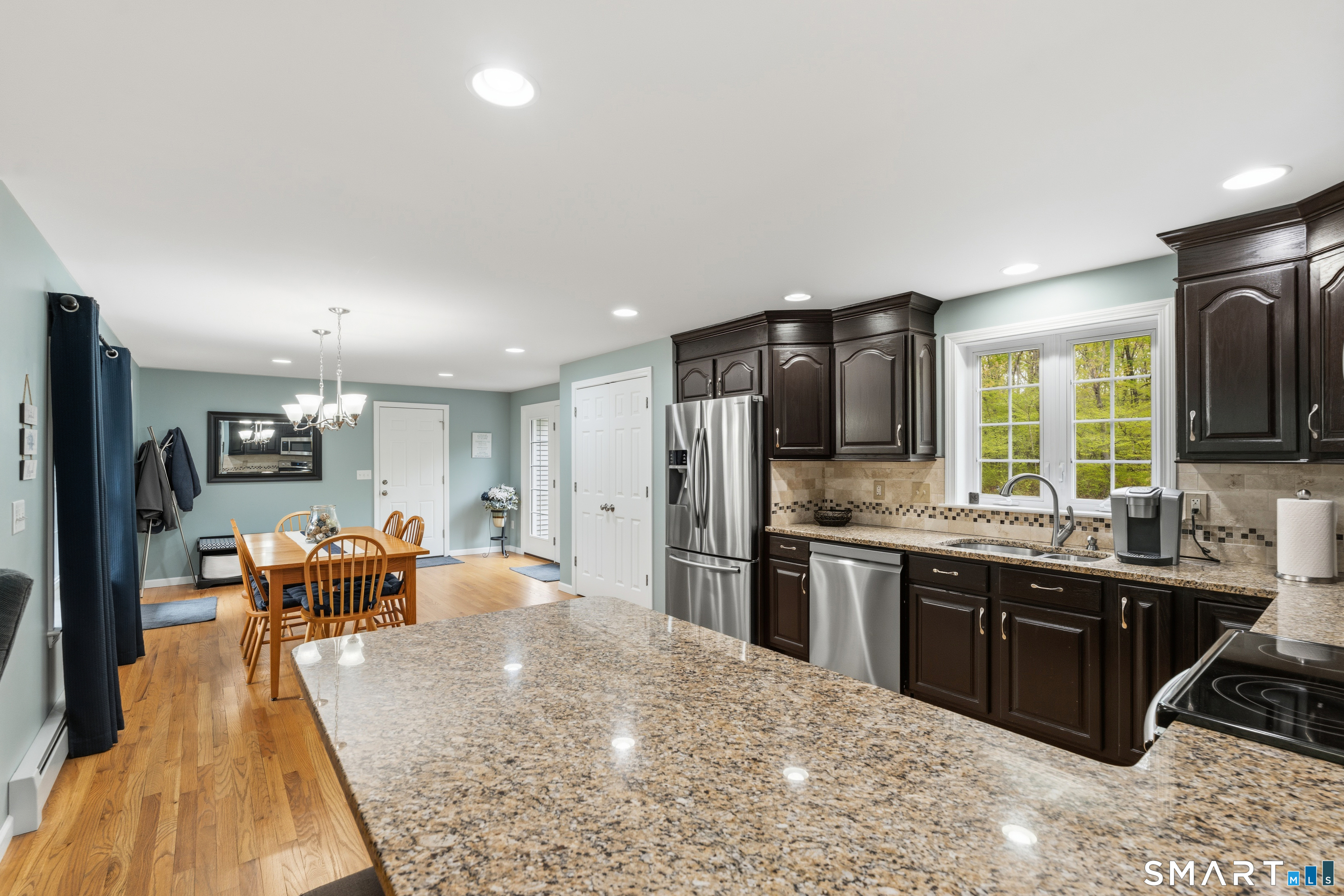 362 Turnpike Road Ashford, CT 06278 - Photo 15 of 40 a large kitchen with stainless steel appliances kitchen island granite countertop a large counter top cabinets and stainless steel appliances