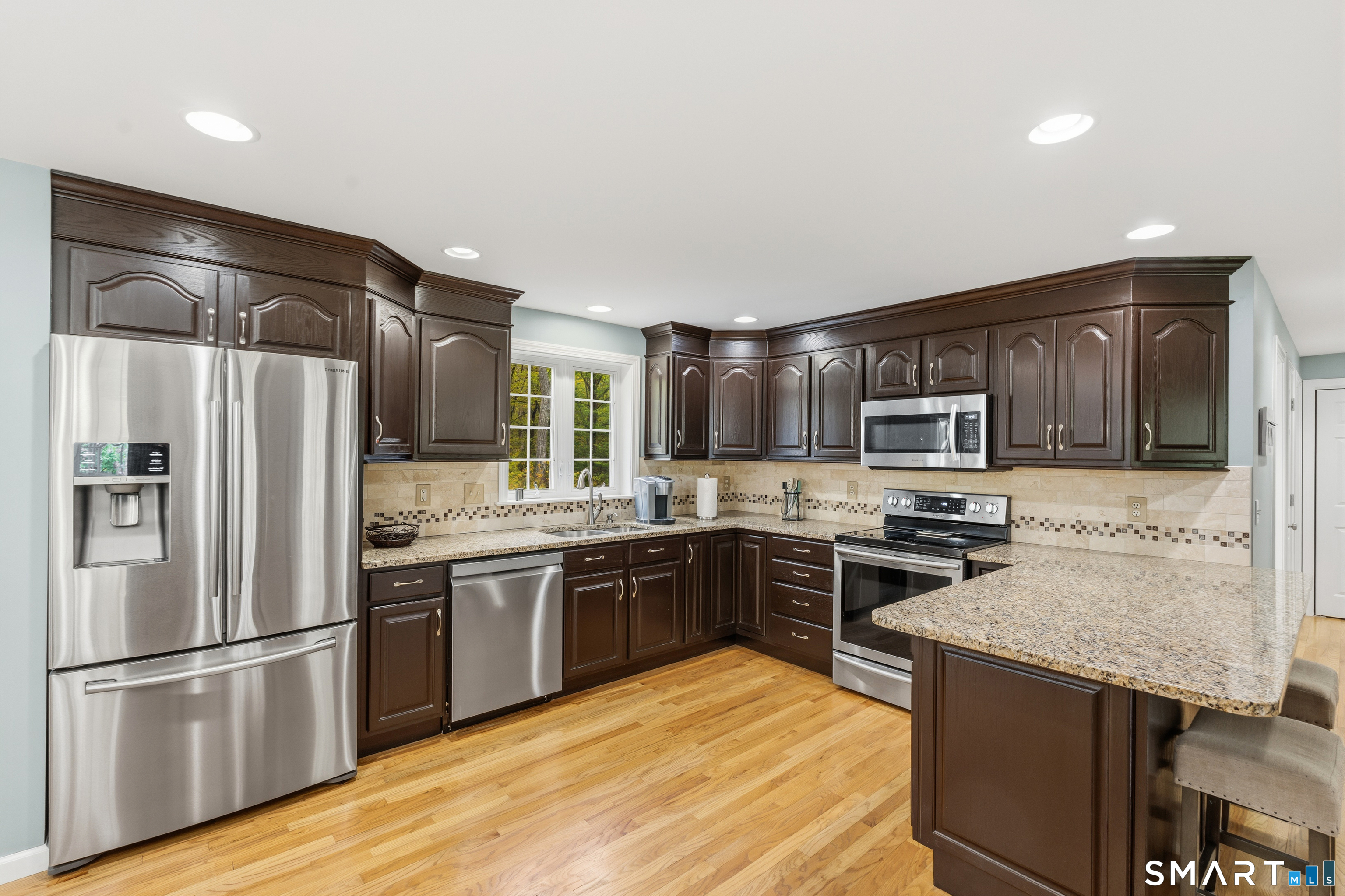 362 Turnpike Road Ashford, CT 06278 - Photo 16 of 40 a kitchen with stainless steel appliances granite countertop a stove top oven a refrigerator a sink and dishwasher